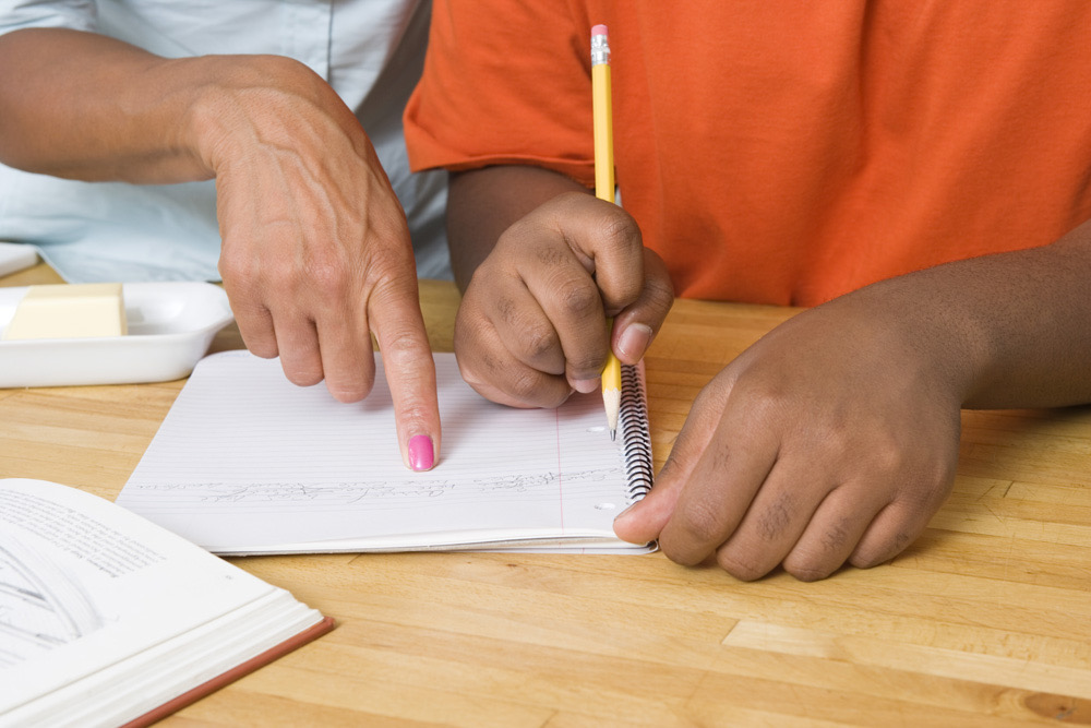 Parent and student working through homework together, the kind of support Lily's Tutoring Services builds for Maryland families